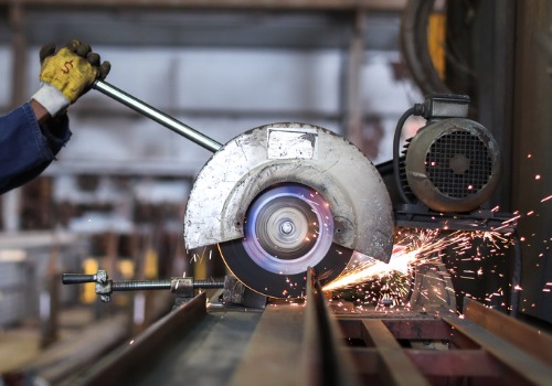 Saw cutting being performed during Sheet Metal Fabrication