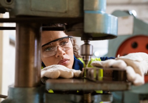 Woman performing machining during Metal Fabrication in South Carolina