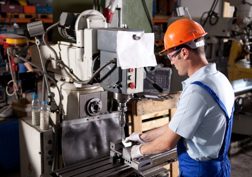 A metal fabricator hard at work shapping metal components