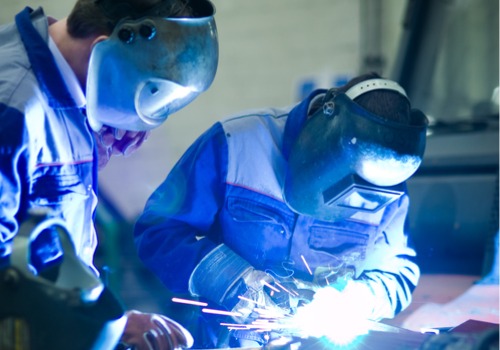 Two welders are seen at work. SMF offers Welding Service in South Carolina.