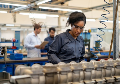 A worker is seen performing mechanical assembly. SMF offers Mechanical Assembly in Springfield IL.