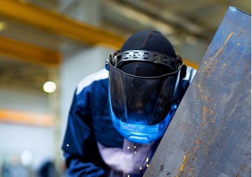 A welder is seen at work. SMF does steel fabrication.