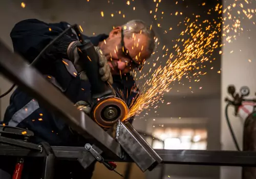 A metalwork professional is seen at work. SMF offers Custom Metal Fabrication in Columbia SC.