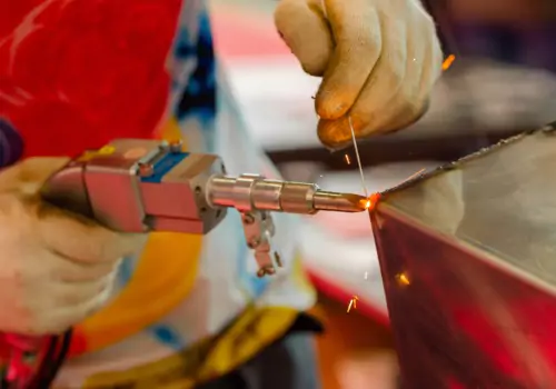 A welder is seen using a laser welding. Is laser welding stronger than MIG or TIG welding? Call SMF.