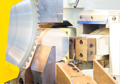 Metal is seen being cut in an industrial setting. SMF offers metal cutting in Peoria IL.