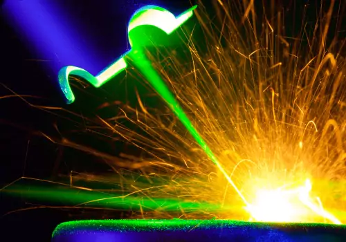 Metal is seen being cut. SMF offers Metal Cutting.