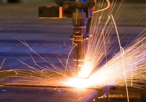 A laser cutter is seen in use. SMF performs metal cutting in South Carolina.