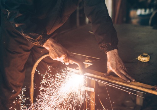 A plasma cutter is seen in use. SMF performs metal cutting.