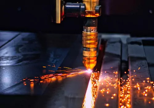 Metal is seen being cut. SMF offers Metal Cutting in Rockford IL.