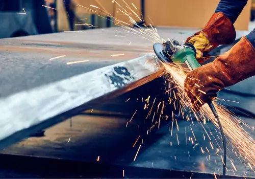 A metal worker is seen on a job. SMF does metal fabrication for construction.
